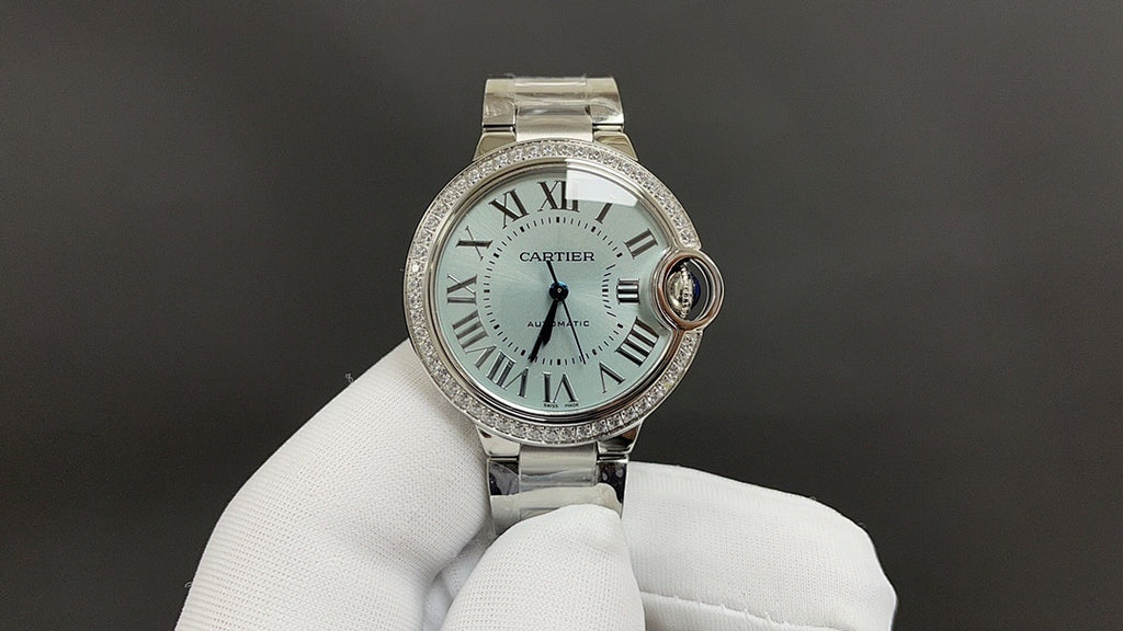 Cartier watch front with silver bracelet, Roman numeral dial, and round crown at 3.