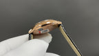 Cartier watch case side and crown, rose-gold finish, black leather strap