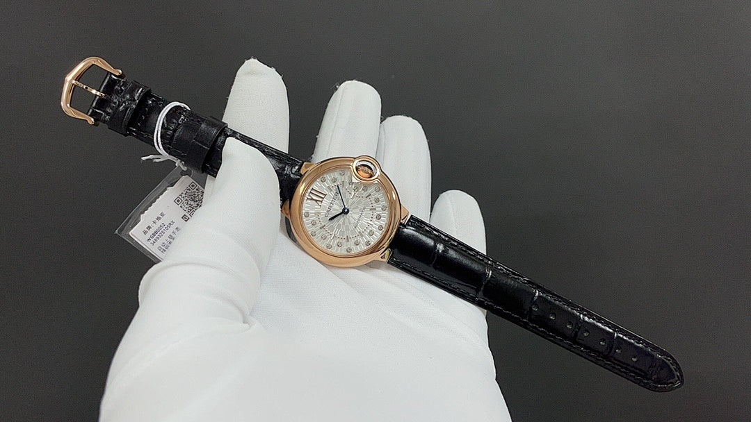 Cartier watch on black leather strap, round rose-gold case with silver dial