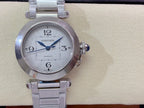 Cartier wristwatch front view with silver dial, blue hands, and stainless steel bracelet