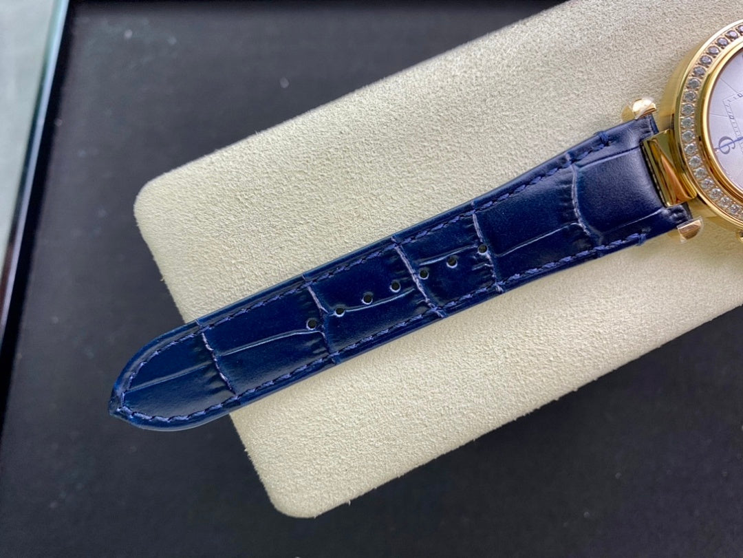 Blue leather watch strap with gold buckle hardware