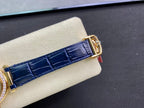 Blue leather strap close-up with gold clasp and stitched detail