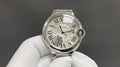 Cartier watch with silver-tone case, Roman numeral dial, iridescent accent, round crown
