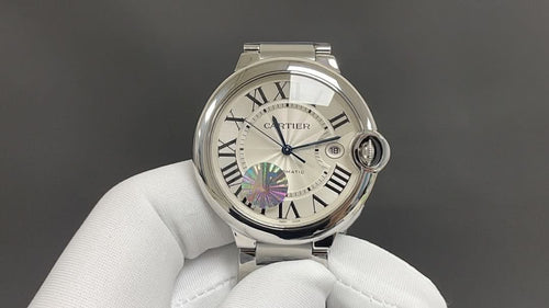 Cartier watch with silver-tone case, Roman numeral dial, iridescent accent, round crown