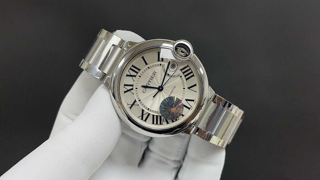 Cartier watch angled view, silver-tone bracelet, Roman numeral dial