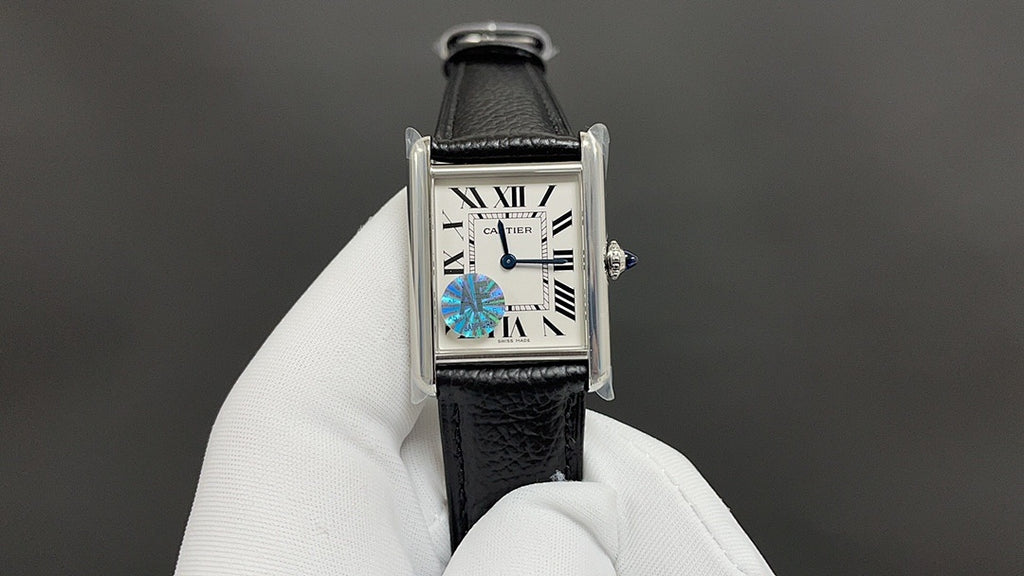 Cartier wristwatch with black leather strap and silver-tone rectangular case