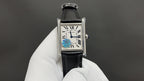 Cartier wristwatch with black leather strap and silver-tone rectangular case