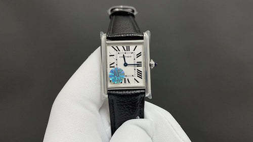 Cartier wristwatch with black leather strap and silver-tone rectangular case