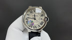 Cartier wristwatch with silver case, Roman dial, black leather strap