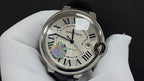 Stainless wristwatch with silver case, Roman dial, black leather strap