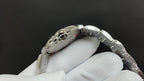 Cartier wristwatch rear view, engraved caseback and metal link bracelet