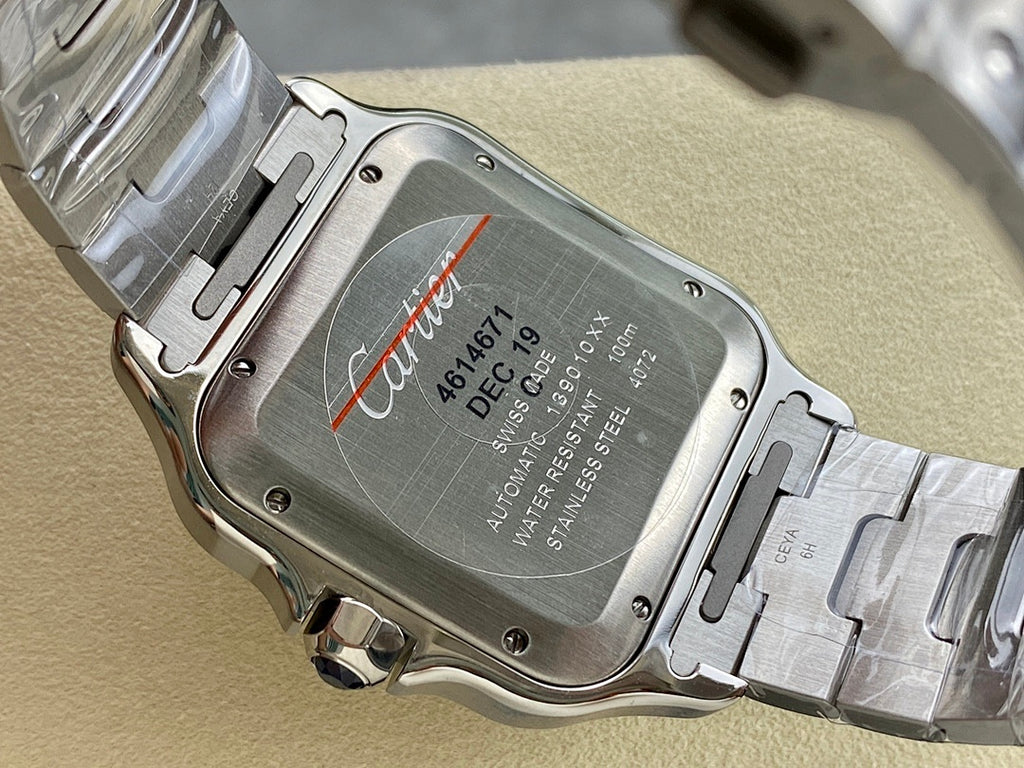 Cartier watch caseback in brushed metal with engraved text and visible screws