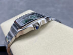 Cartier wristwatch with green dial, silver case, and blue-accent crown