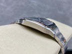 Cartier wristwatch side profile with ridged bezel and brushed silver case