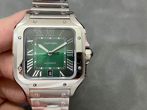 Cartier watch on hand, green dial with Roman numerals, stainless steel bracelet