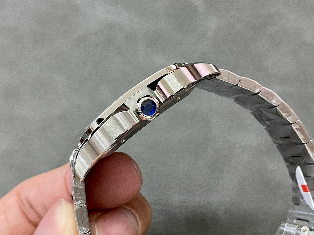 Cartier watch top view showing blue gemstone set in stainless steel bezel