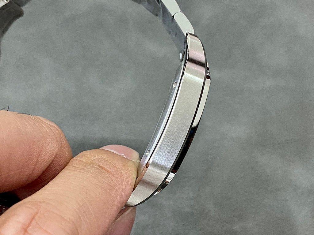 Cartier watch side view with stainless steel case and bracelet links