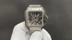 Luxury watch by Cartier with square skeleton dial and silver-toned metal case