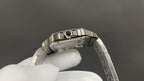 Luxury watch by Cartier with silver-toned bezel and metal link bracelet