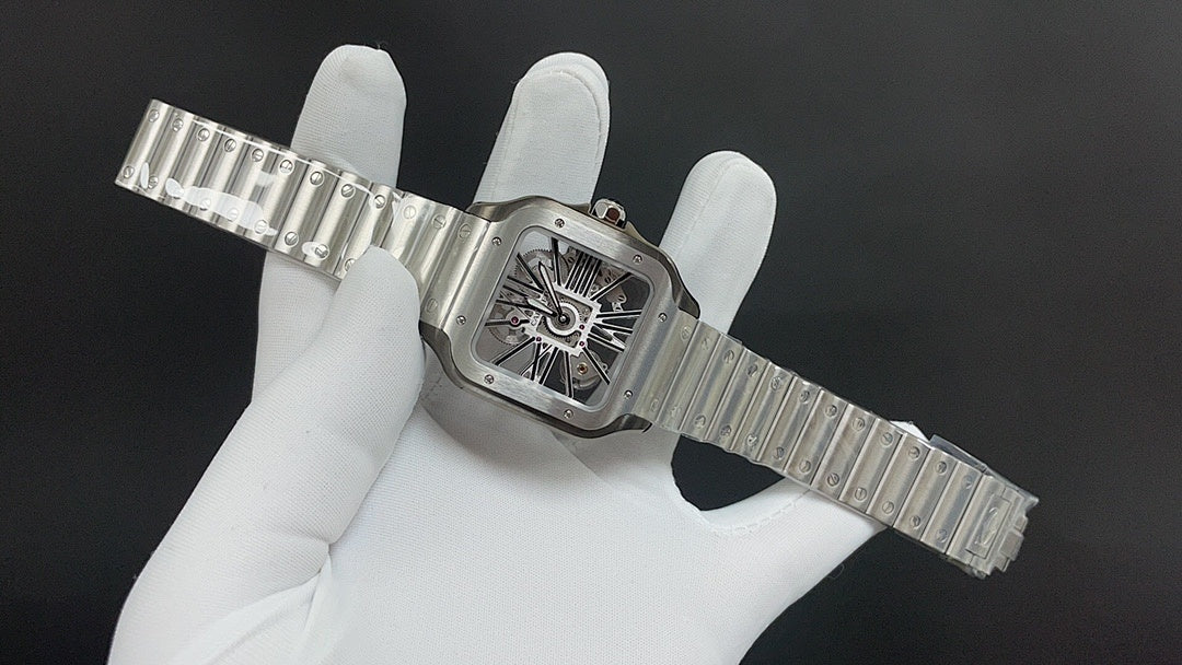 Luxury watch by Cartier with rectangular skeleton dial and silver-toned link bracelet
