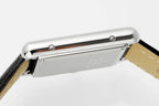 Cartier watch crown side view with stainless steel case and integrated bracelet
