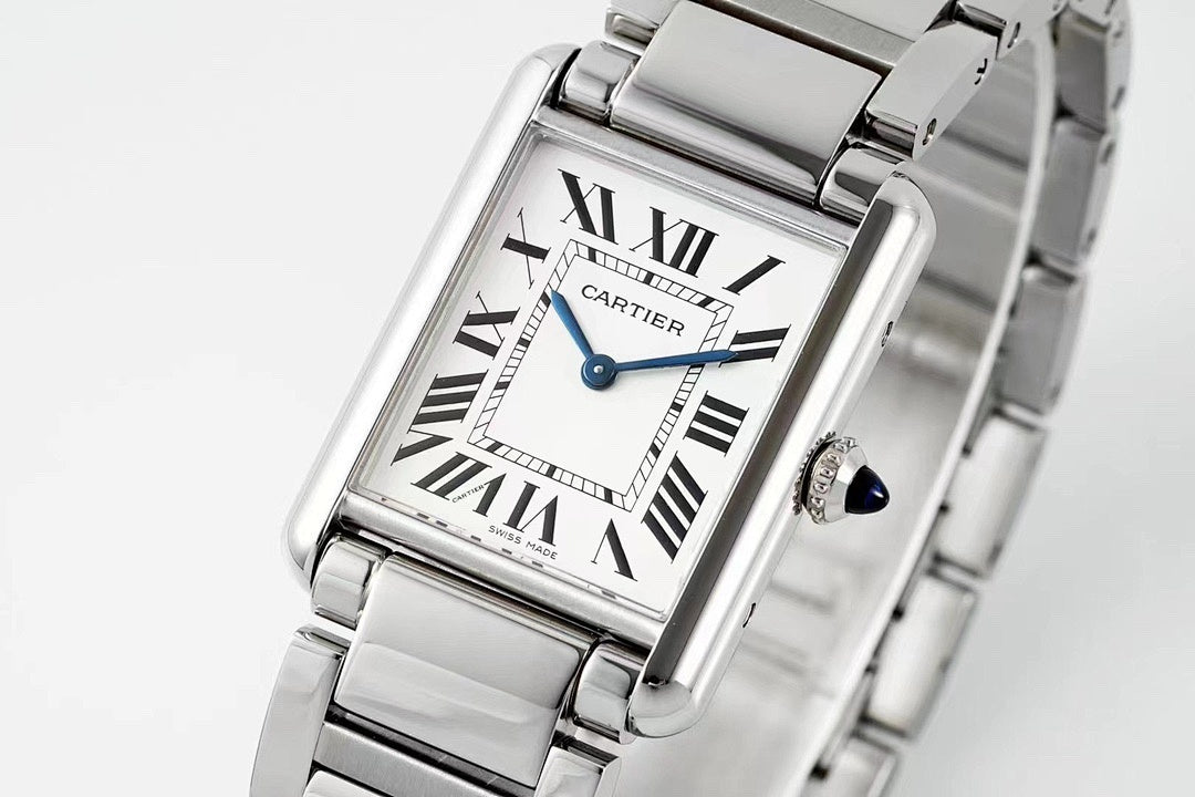 Cartier watch front view with Roman numeral dial, blue hands, and stainless bracelet
