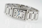 Cartier watch on wrist with rectangular Roman numeral dial and stainless steel band