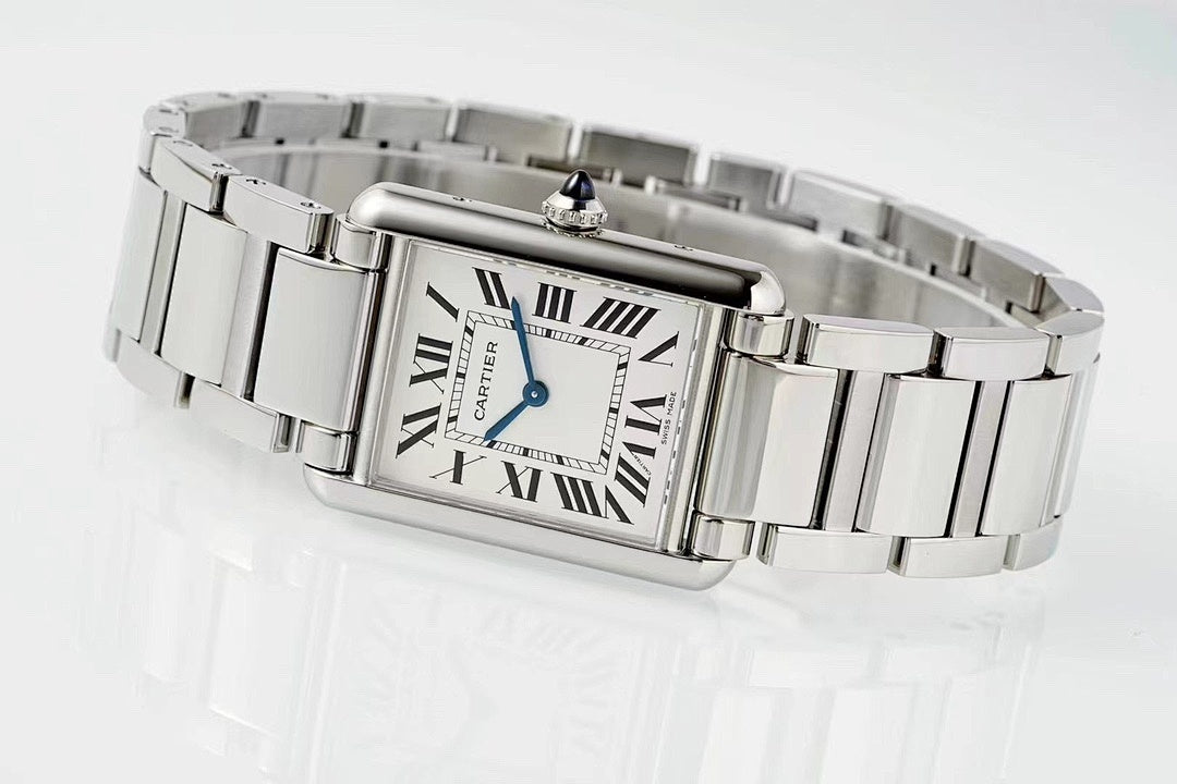 Cartier watch on wrist with rectangular Roman numeral dial and stainless steel band