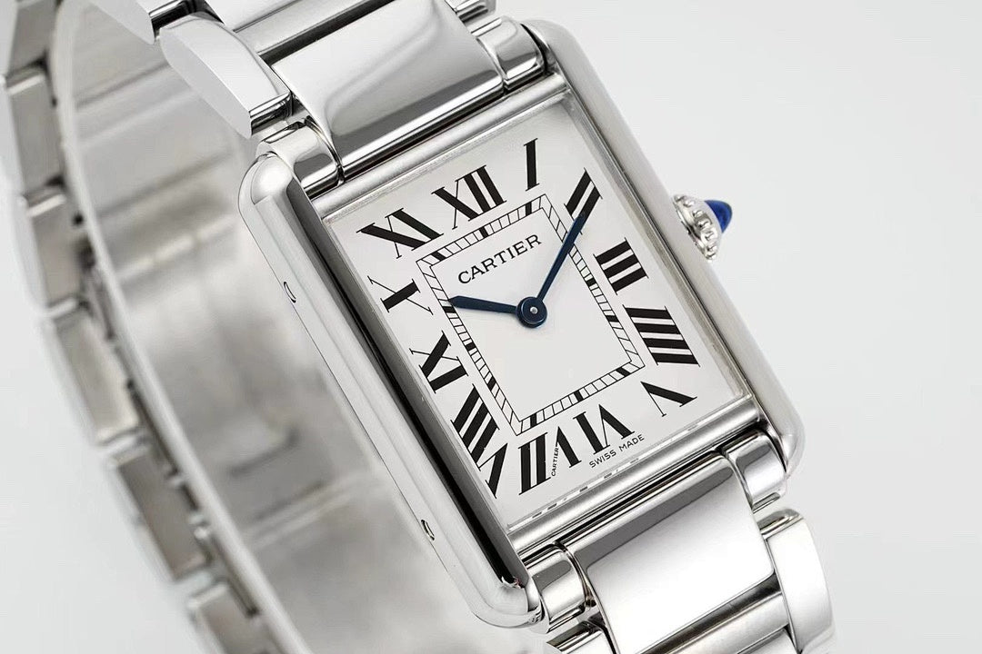 Cartier watch angled close-up showing Roman numeral dial and blue seconds hand