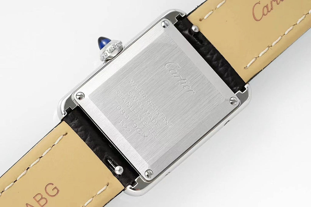 Cartier watch side view with engraved steel backplate and black leather strap, buckle end