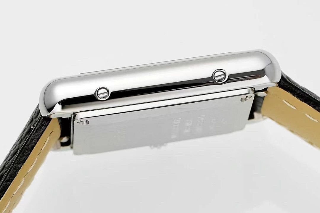 Cartier watch top view with silver case and black leather strap
