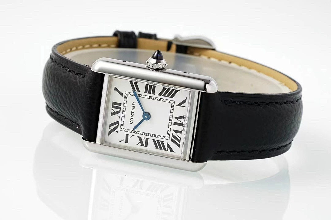 Cartier wristwatch with black leather strap, silver buckle, and Roman numeral dial