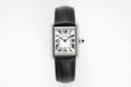 Cartier wristwatch with black leather strap and rectangular silver case, Roman dial