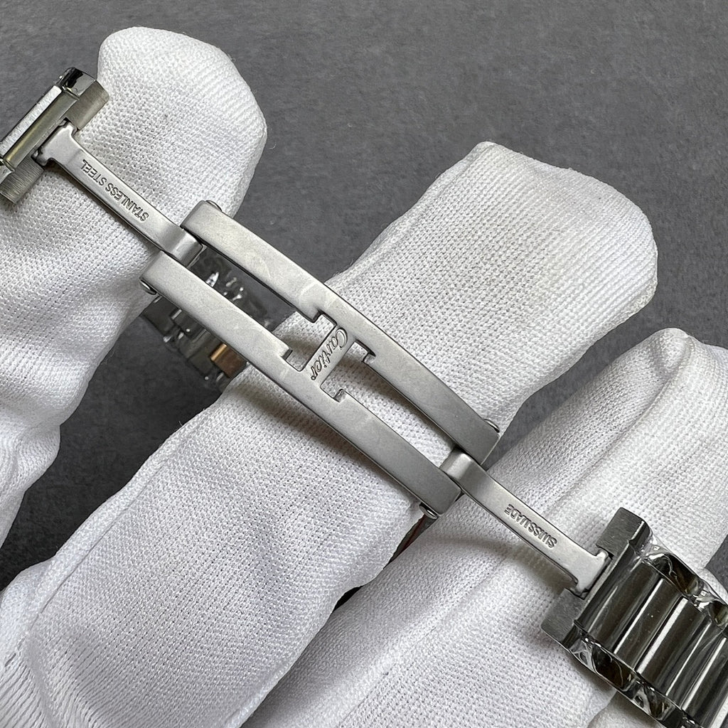 Cartier watch clasp and links with polished silver finish and gold-tone accents