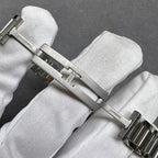 Cartier watch clasp and links with polished silver finish and gold-tone accents