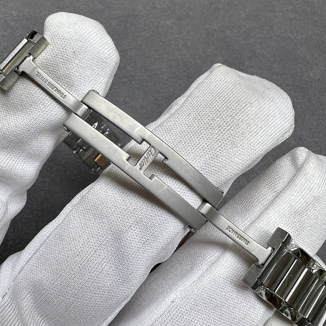 Cartier watch clasp and links with polished silver finish and gold-tone accents