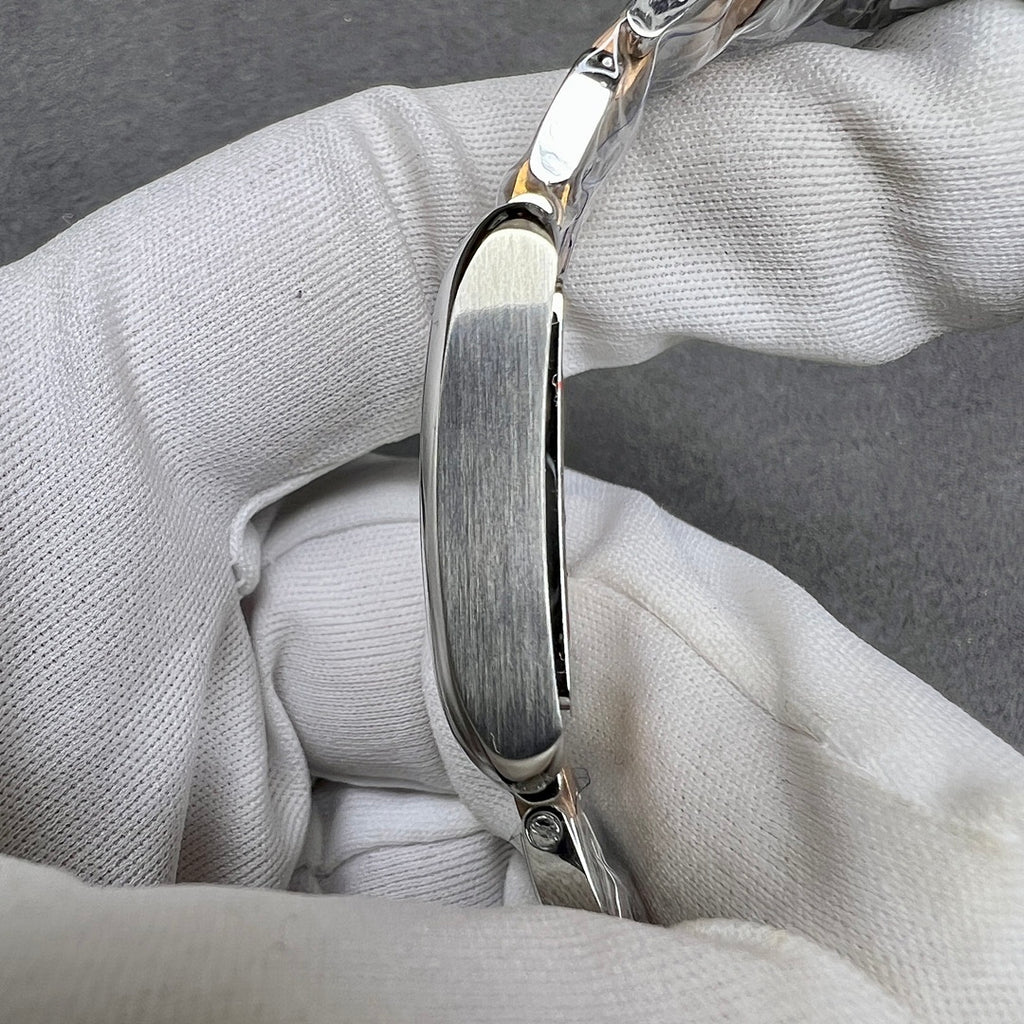 Cartier watch case profile with polished bezel and integrated crown