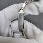Cartier watch case profile with polished bezel and integrated crown