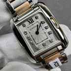 Cartier square dial wristwatch with patterned center, Roman numeral XII, and gem markers