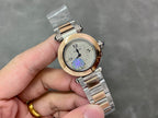 Cartier watch with gold bezel and silver bracelet; white dial with blue/purple circular motif