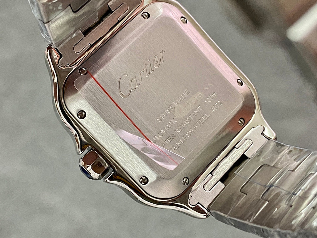 Cartier steel watch case back with Cartier logo and engraved text