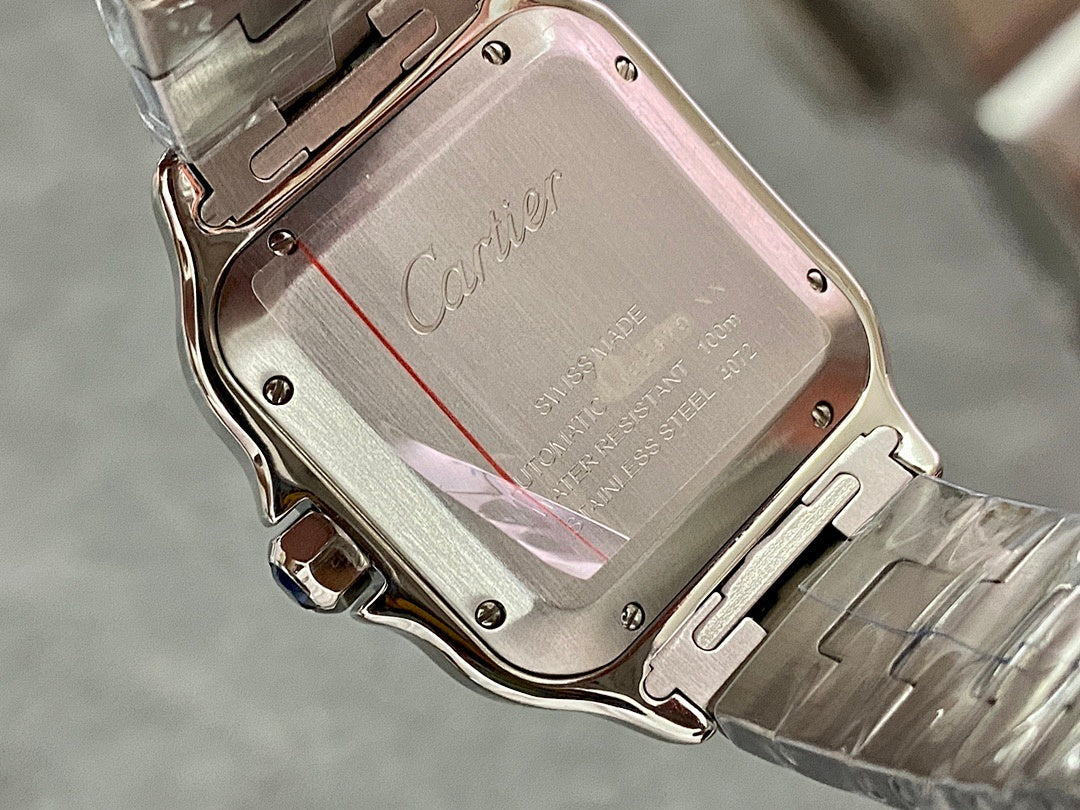 Cartier steel watch case back with Cartier logo and engraved text