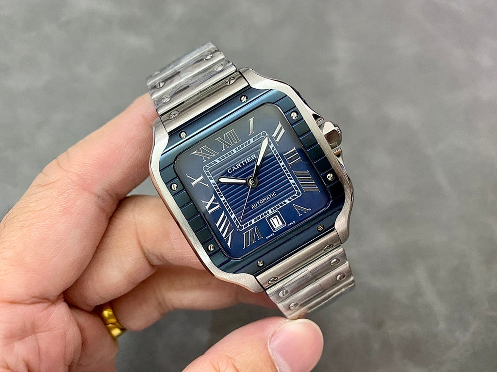 Cartier steel watch with blue dial, Roman numerals, and automatic details
