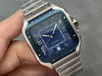 Cartier steel watch dial close-up with Roman numerals and Cartier logo