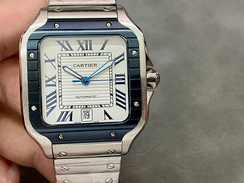 Cartier wristwatch front view with blue dial, Roman numerals, steel case and bracelet