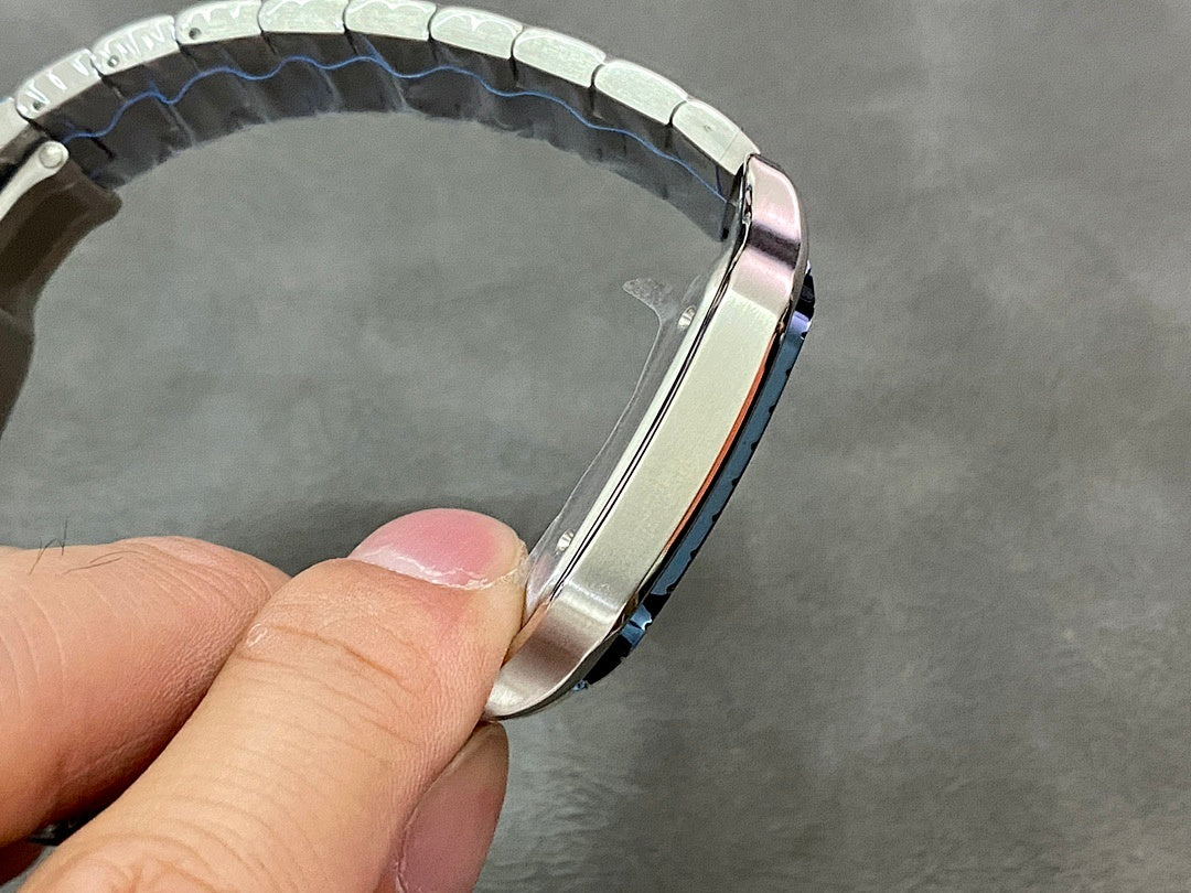 Cartier wristwatch bracelet edge in steel with polished links, side angle