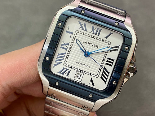 Cartier wristwatch with blue dial, Roman numerals, steel case, and link bracelet