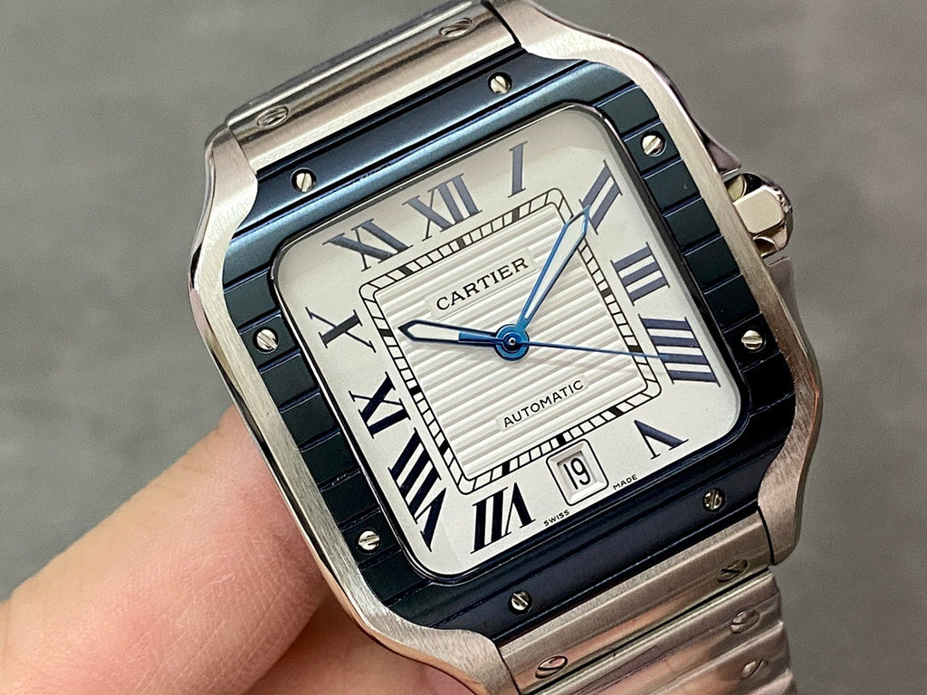 Cartier wristwatch close-up with blue dial, Roman numerals, and steel case