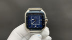 Stainless steel Cartier watch with blue dial and Roman numerals