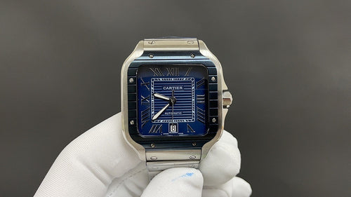 Stainless steel Cartier watch with blue dial and Roman numerals